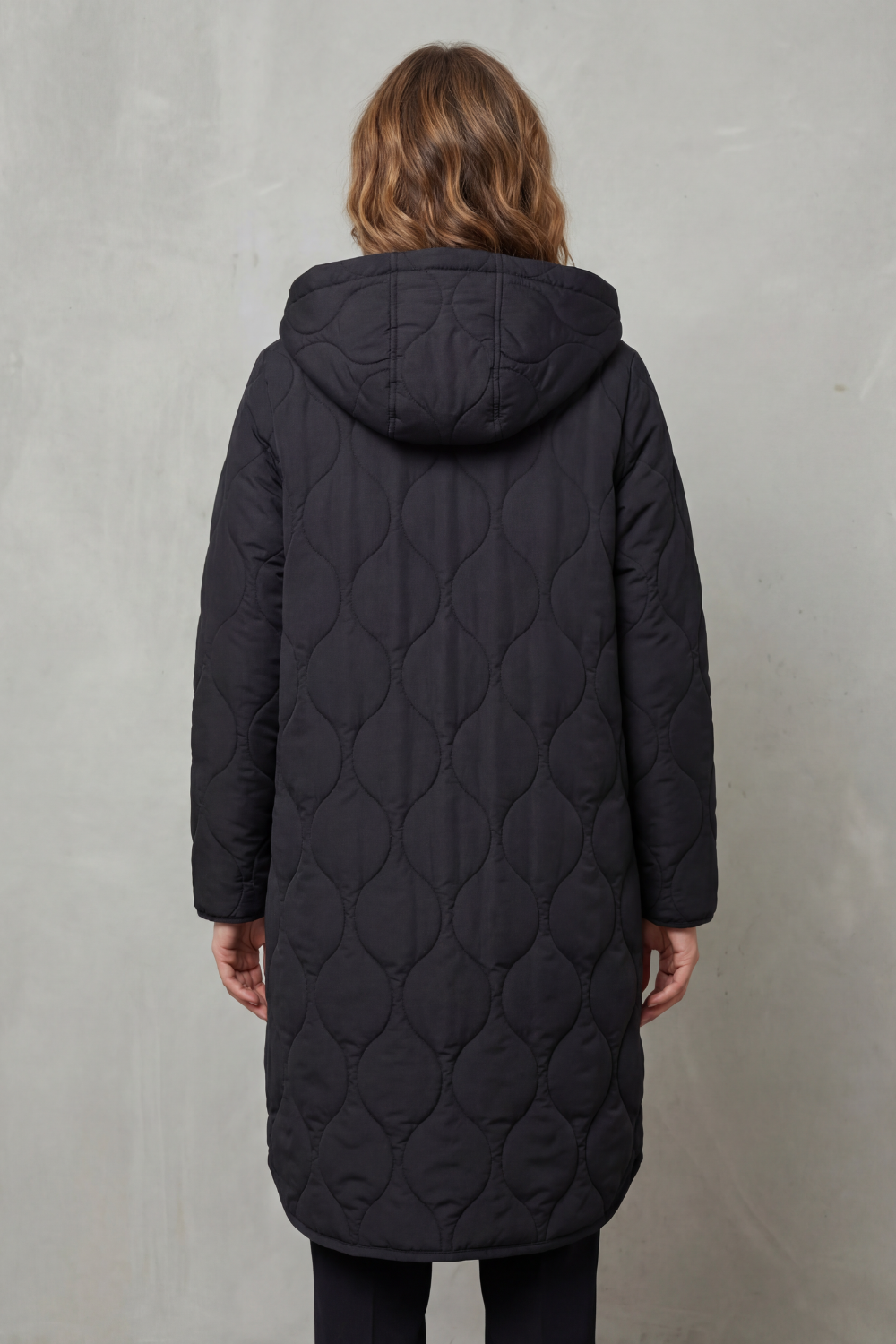 Woman wearing a stylish, casual parka coat, ideal for everyday fall and winter outings.