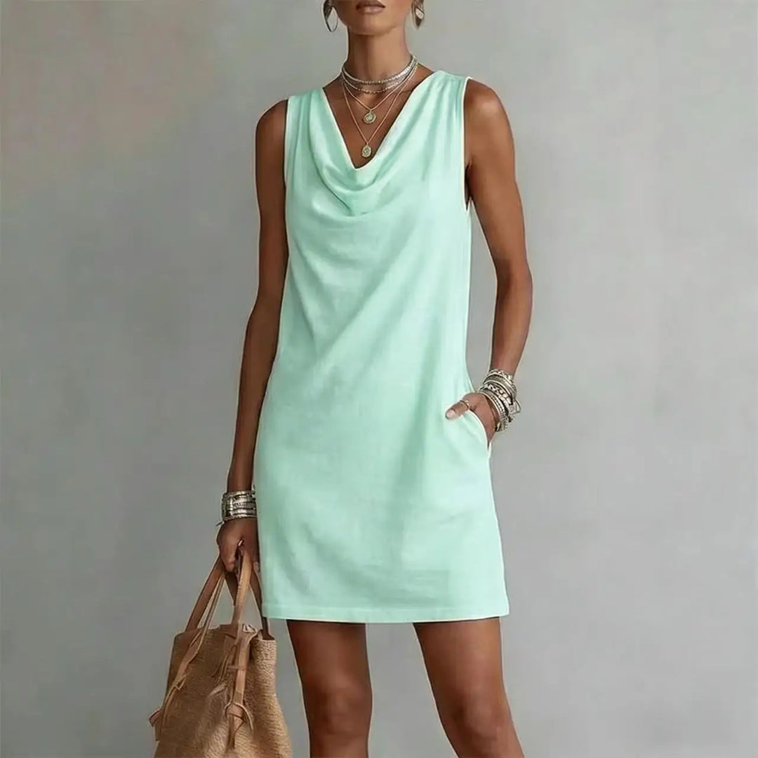 Versatile women's mini dress, cowl neck & sleeveless, featuring a relaxed A-line fit & functional pockets.