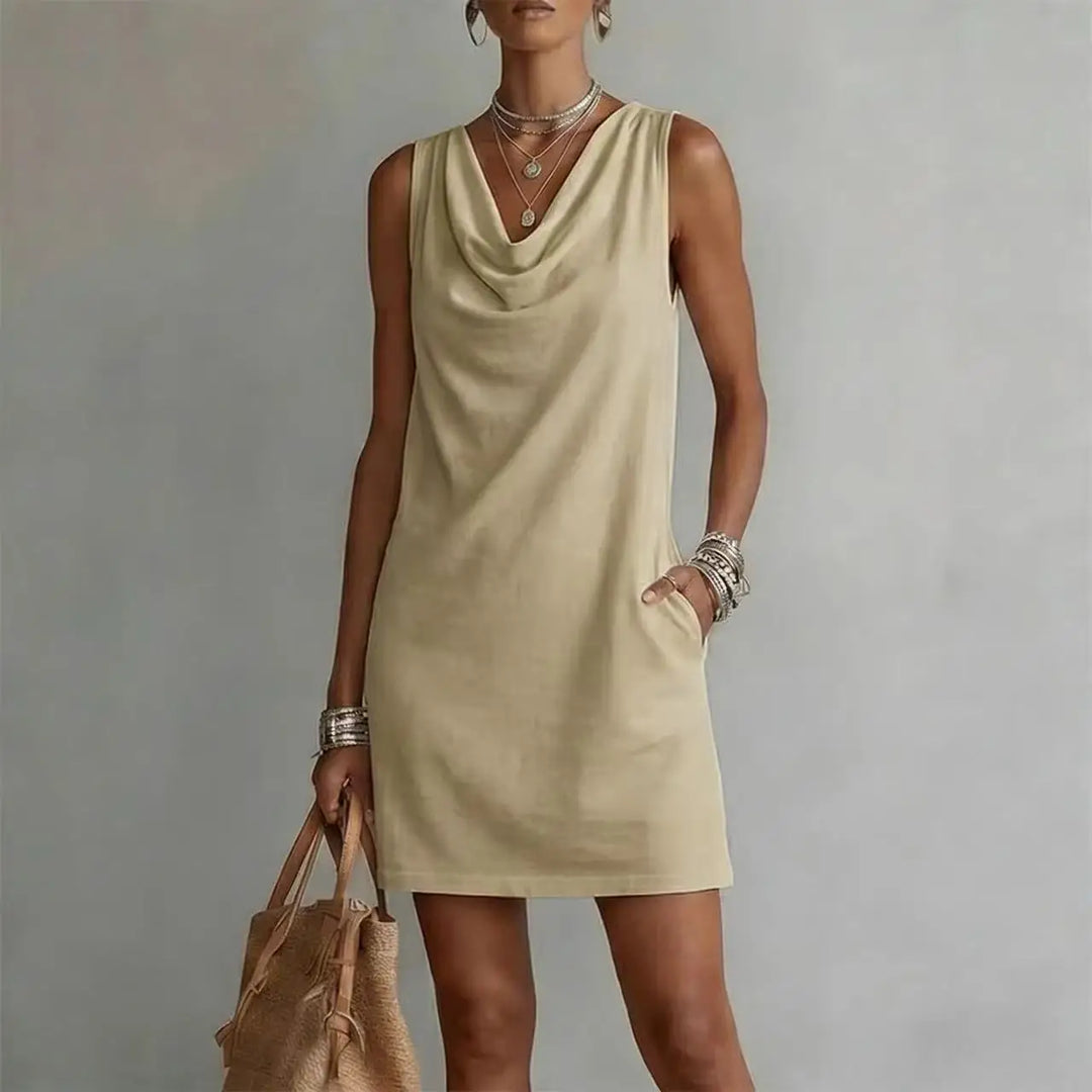 Stylish women's mini dress with a flattering cowl neck, practical pockets, and a comfortable relaxed fit for summer.