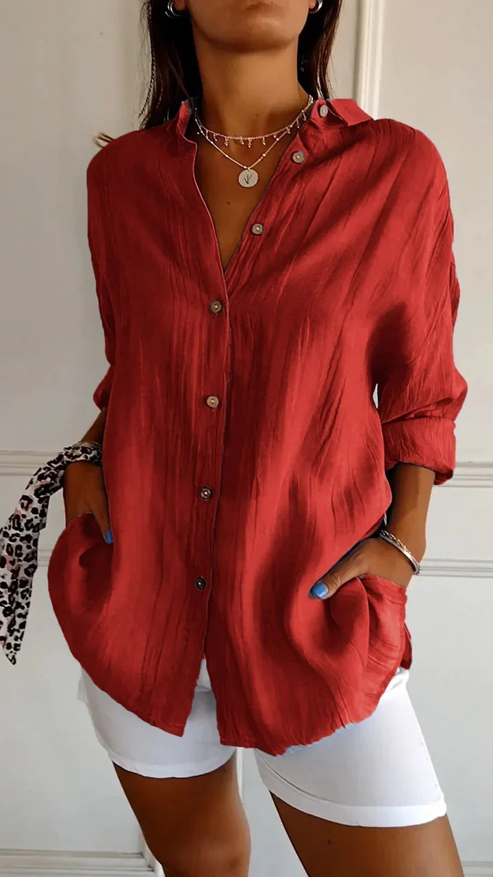 Soft-touch women's button-down shirt, a comfortable long-sleeve piece for versatile daily fashion.