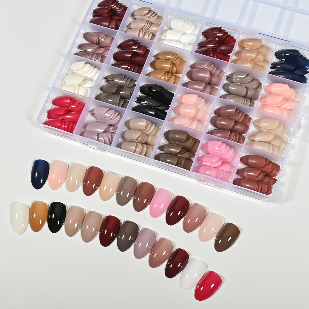 Elegant pink almond press-on false nails, perfect for a chic women's DIY manicure. Salon-quality nail art.