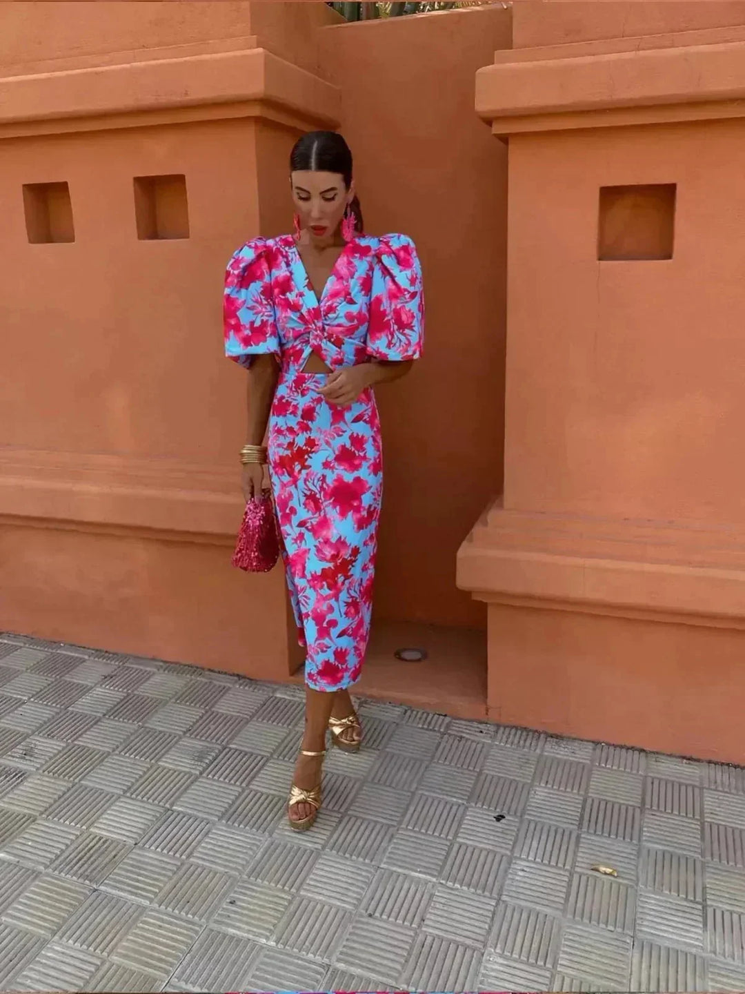 Vibrant abstract print midi dress for women, featuring a flattering V-neck and stylish puff sleeves, ideal for formal wear.