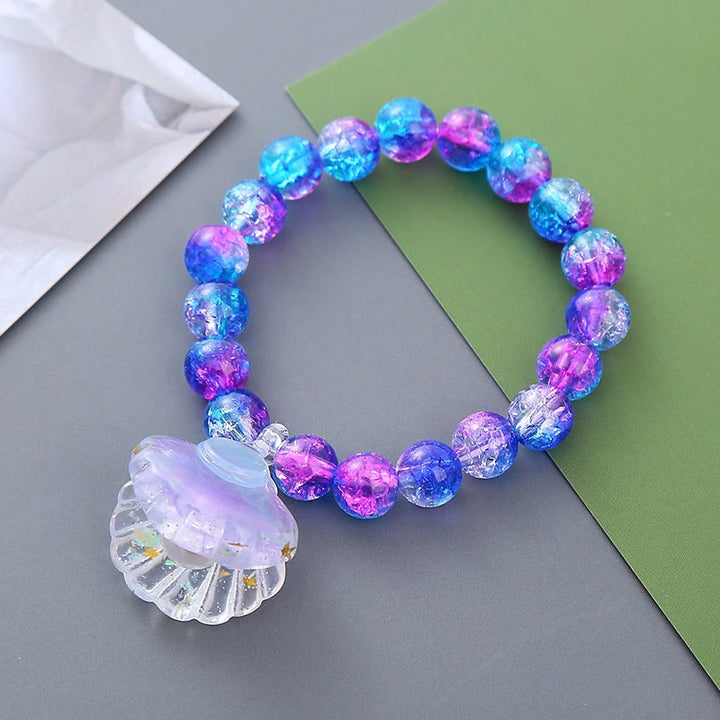Stylish women's vibrant beaded bracelet with a shell pendant. Great for beach & summer fashion accessory.