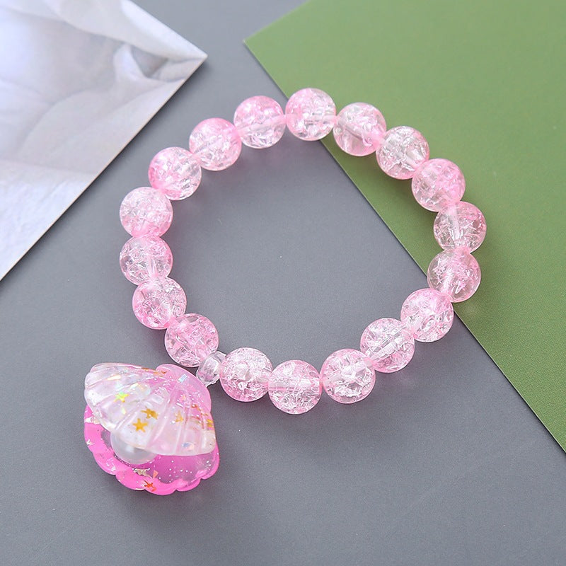Multi-color beaded bracelet for women, adorned with a charming shell pendant. Trendy summer accessory.