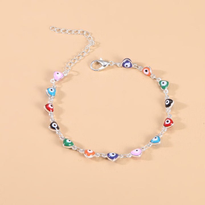 Close-up: Women's evil eye charm anklet featuring vibrant, colorful beads & protection.