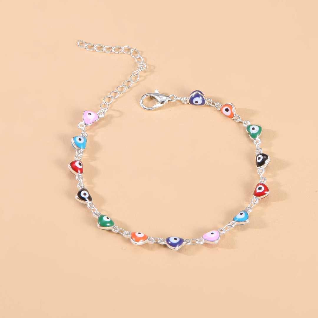 Women's fashion evil eye charm anklet, vibrant colors, protective jewelry accessory.