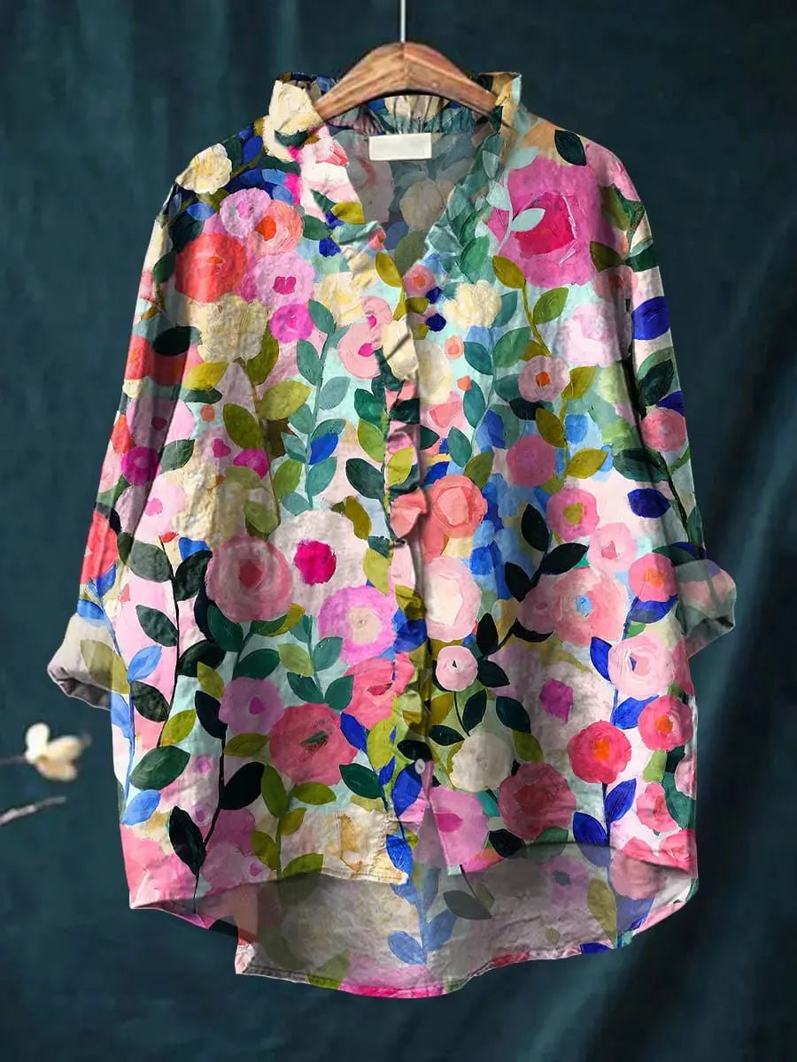 Women's vibrant floral ruffle blouse for elegant spring & summer style. Relaxed fit top, perfect for casual chic outfits.