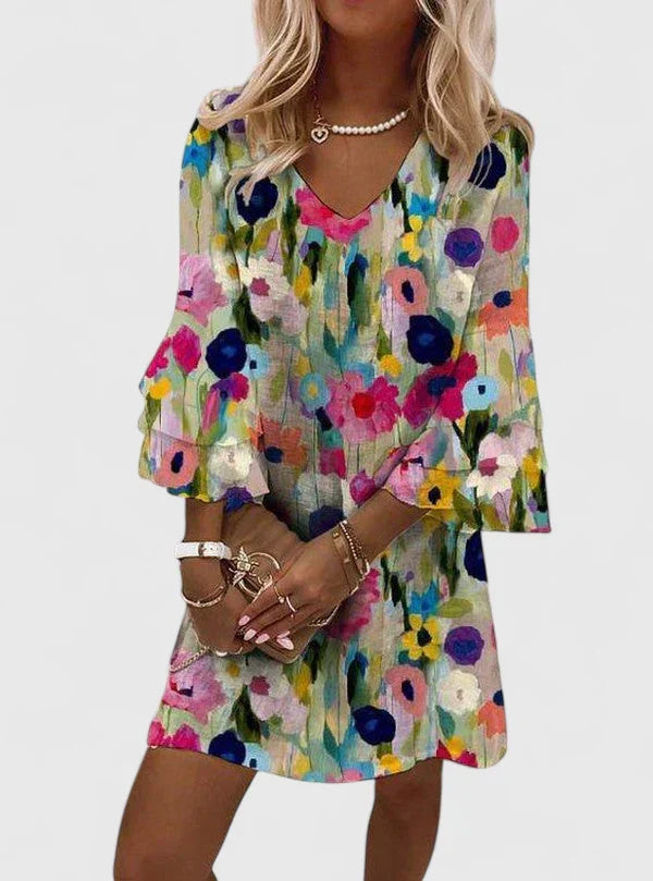 Women's vibrant floral V-neck mini dress, perfect for summer casual wear. Short, fashionable summer style.