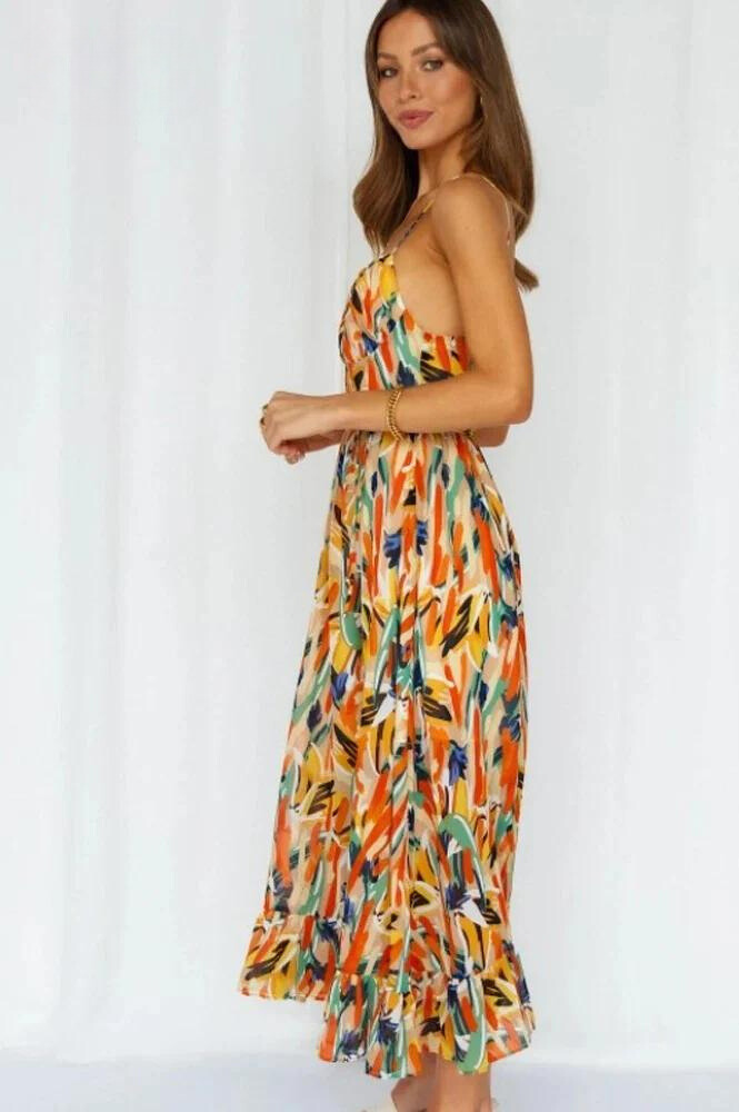 Flowy summer midi dress for women, offering vibrant style and comfort for vacation or casual wear.