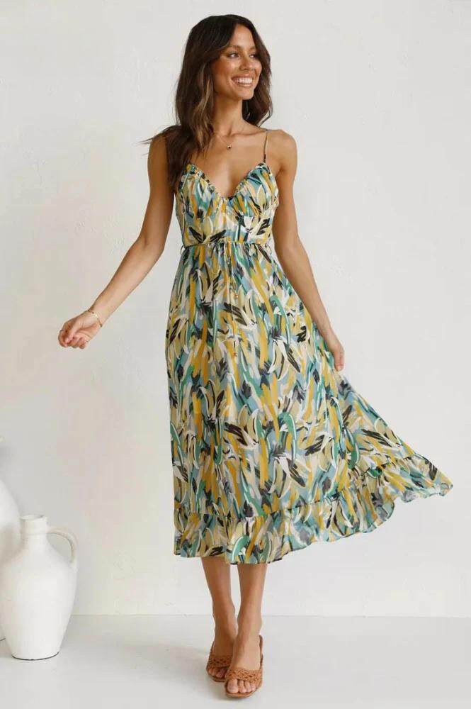 Women's vibrant midi dress, perfect flowy beachwear for summer vacations and elegant casual outings.