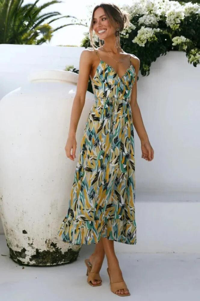 Vibrant women's midi dress, an essential flowy summer vacation outfit for stylish casual elegance.