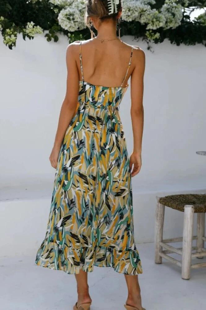 Elegant vibrant flowy midi dress for women, a colorful summer essential for casual or vacation wear.