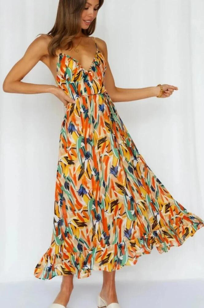 Vibrant flowy women's summer midi dress, a colorful and elegant choice for beachwear and vacations.