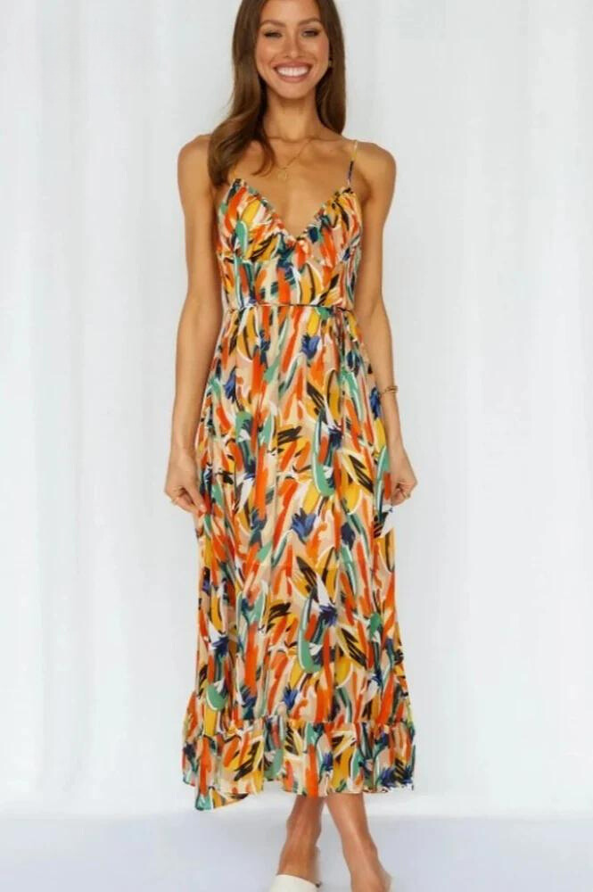 Women's colorful summer midi dress, vibrant and flowy, offering casual elegance for any occasion.