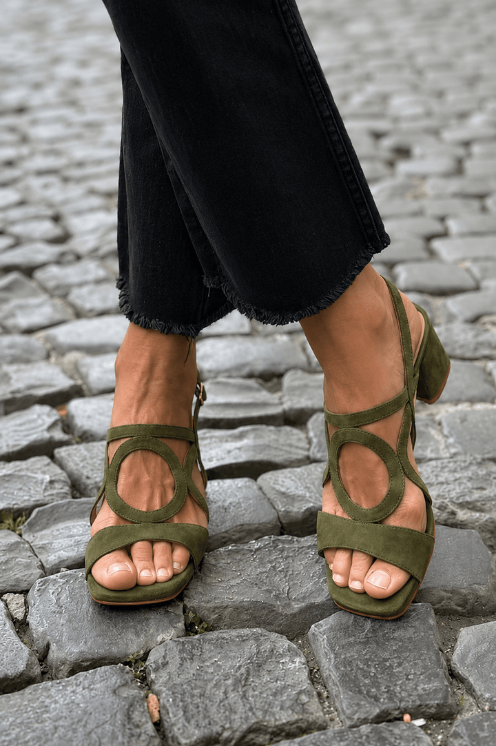 Collection of vibrant heeled summer sandals, featuring various colors for stylish women.
