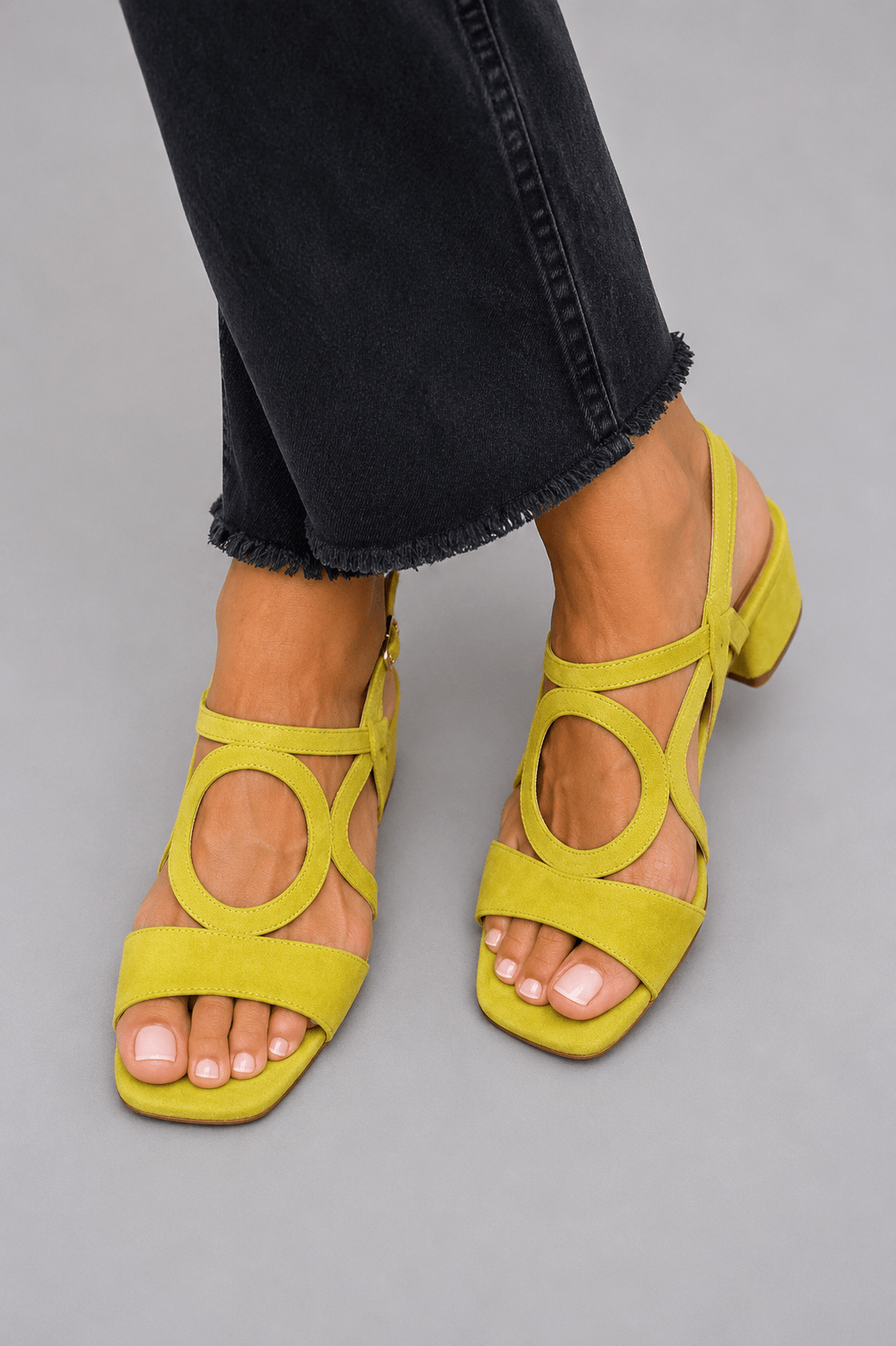 Bright yellow women's heeled sandals, vibrant summer shoes for elegant style.