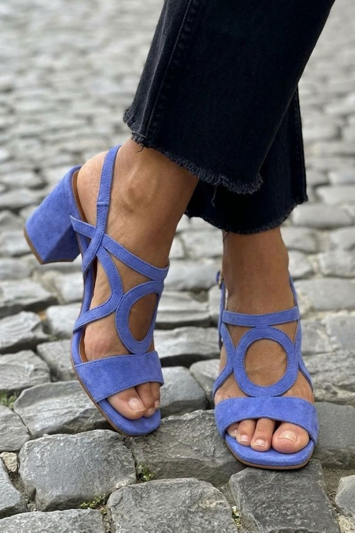 Bold orange women's heeled sandals, comfortable & chic summer fashion.