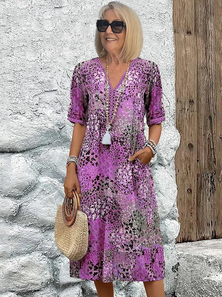 Versatile women's midi dress with a vibrant pattern, elegant flowing design for various occasions.