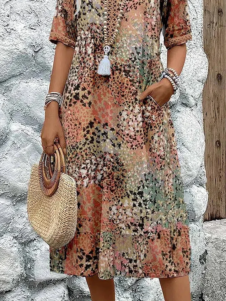 Back view of women's vibrant pattern midi dress, showcasing flowing elegance & comfortable style.