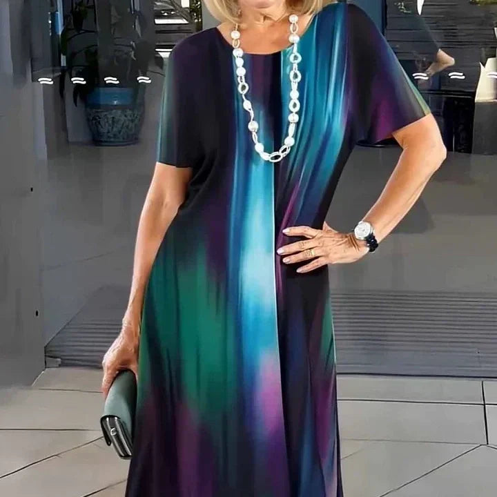 Vibrant patterned women's A-line midi dress with short sleeves, a comfortable and versatile piece for summer.