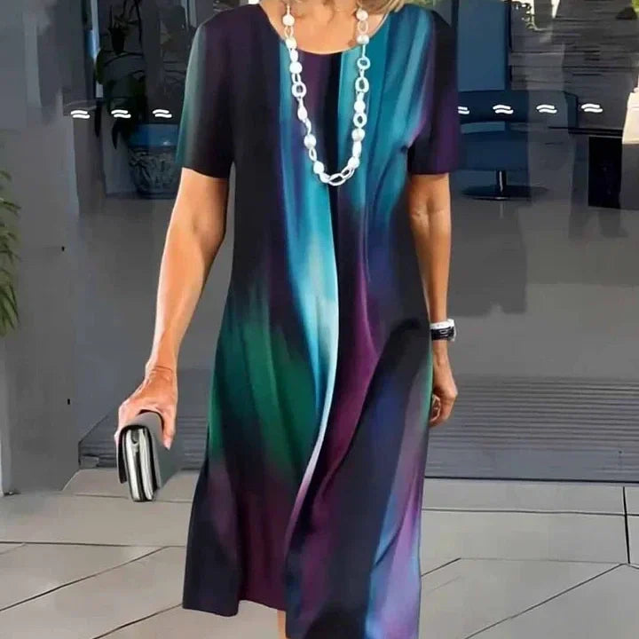 Casual short sleeve A-line midi dress for women, vibrant print, comfortable and flowy for summer fashion.