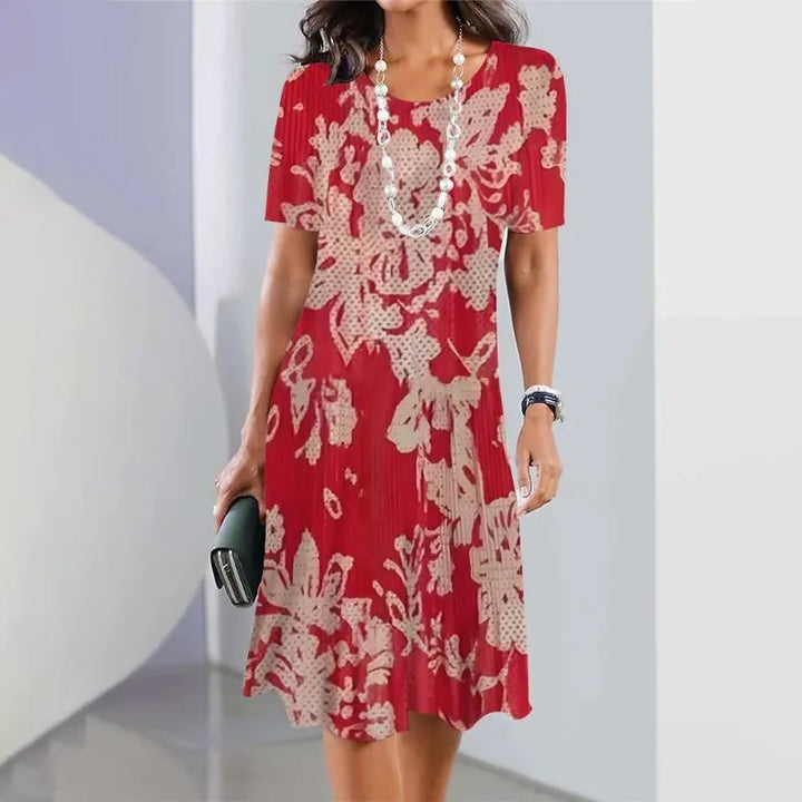 Elegant women's A-line midi dress, short sleeves, vibrant all-over print, perfect for summer casual fashion.