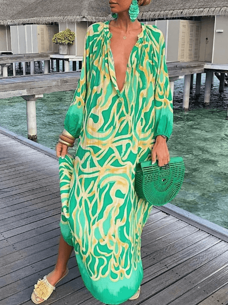 Flowy women's summer vacation dress, vibrant print, comfortable short style, perfect for sunny beachwear.