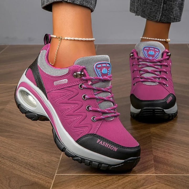 Colorful women's all-weather trekking shoes, designed for comfortable walking & anti-slip performance on trails.