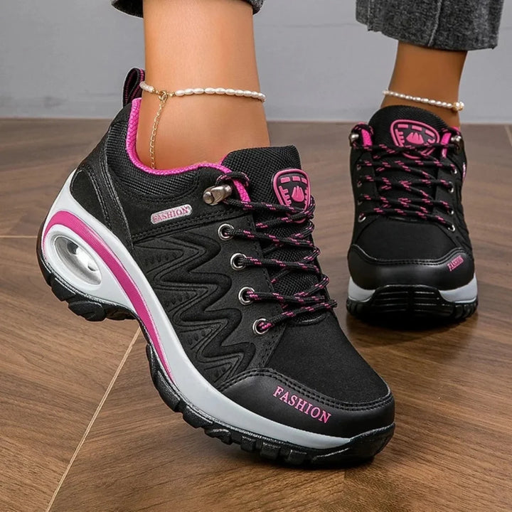 New women's water-resistant trail shoes with a vibrant design, perfect for comfortable casual hiking & trekking.