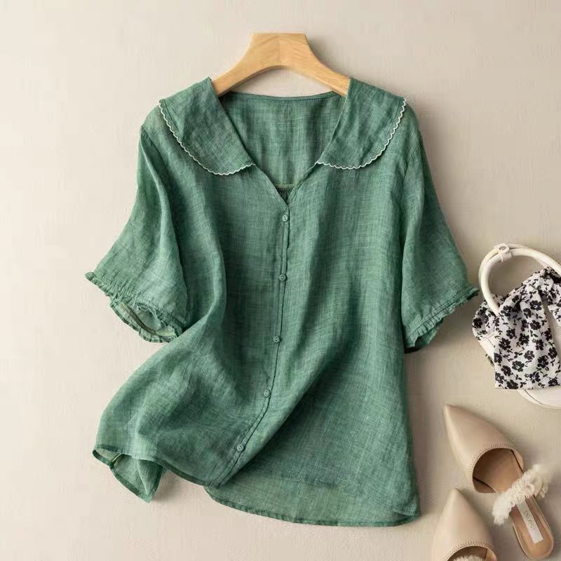 Women's vintage blouse with elegant button detail, long sleeves, and a relaxed, feminine fit. Perfect for casual chic.