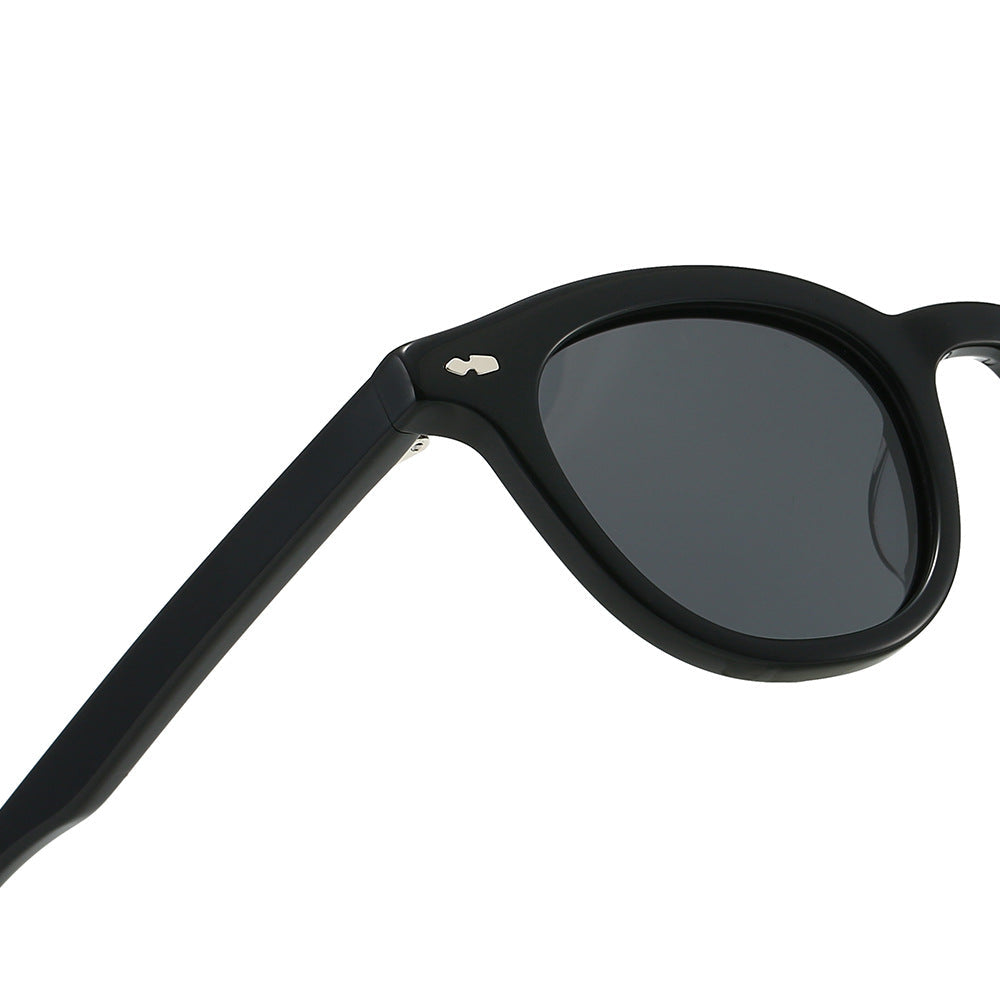Stylish black women's vintage sunglasses. Classic UV protection eyewear, a retro fashion accessory.