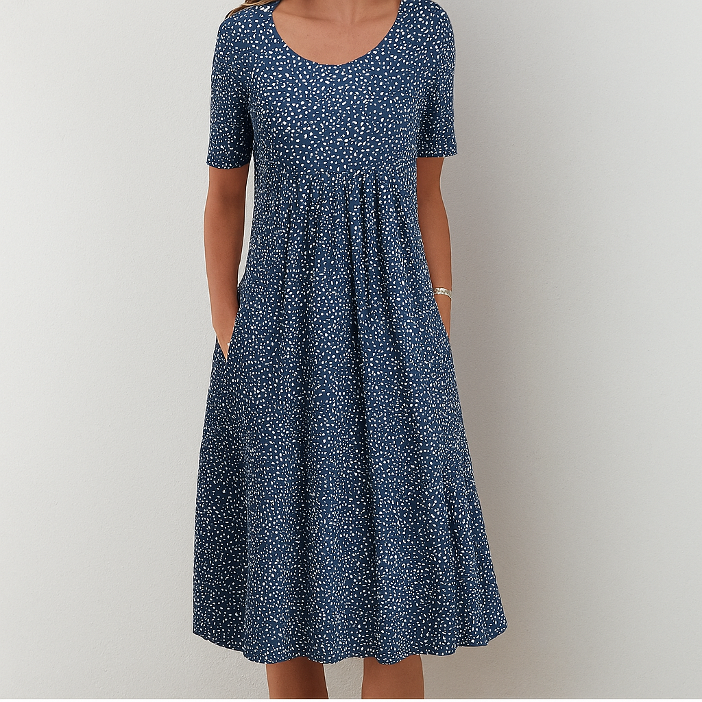 Flowy knee-length women's summer dress in a comfortable floral vintage style with elegant ruffle details.