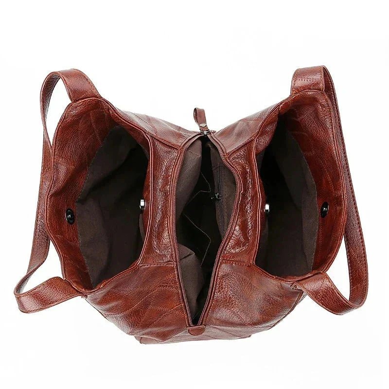 Elegant black genuine leather hobo bag. Women's vintage style shoulder bag, versatile.