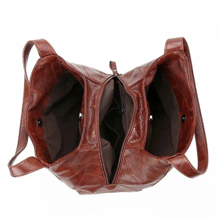 Elegant black genuine leather hobo bag. Women's vintage style shoulder bag, versatile.