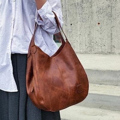 Genuine leather hobo bag for women. Vintage style black shoulder bag for everyday use.