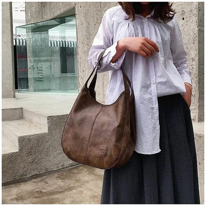 Red genuine leather hobo bag. Stylish women's vintage shoulder bag, perfect for everyday carry.