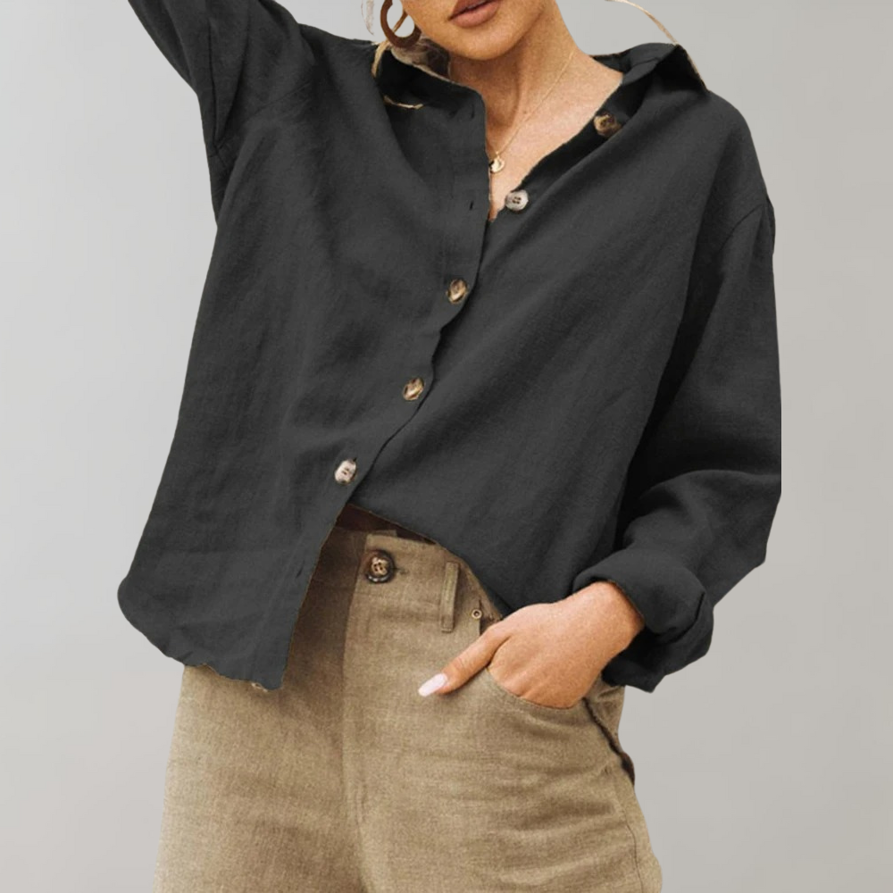 Women's vintage-inspired relaxed fit button blouse. Long sleeve collared top for casual or elegant wear.