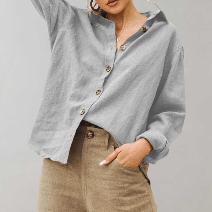Elegant women's vintage style long sleeve button-down blouse. Versatile relaxed fit top, perfect for everyday fashion.