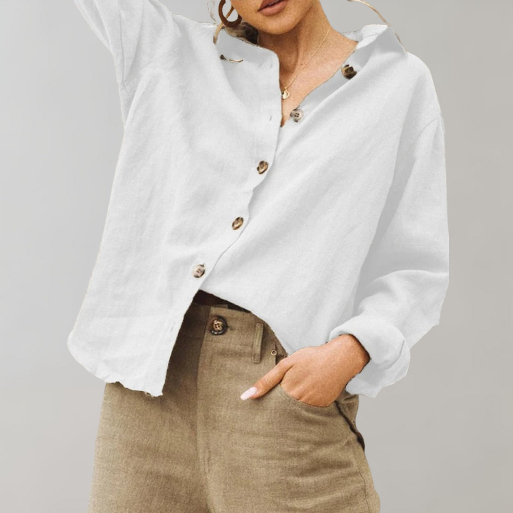 Relaxed fit women's button blouse in a vintage-inspired style. Long sleeve, collared shirt for casual elegance.