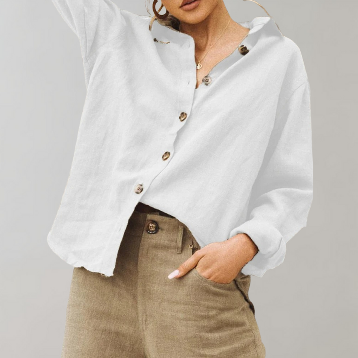 Relaxed fit women's button blouse in a vintage-inspired style. Long sleeve, collared shirt for casual elegance.