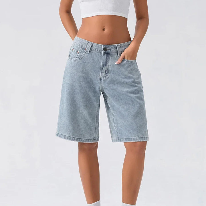 Classic women's relaxed fit denim shorts with a low rise and vintage wash, ideal for summer fashion.