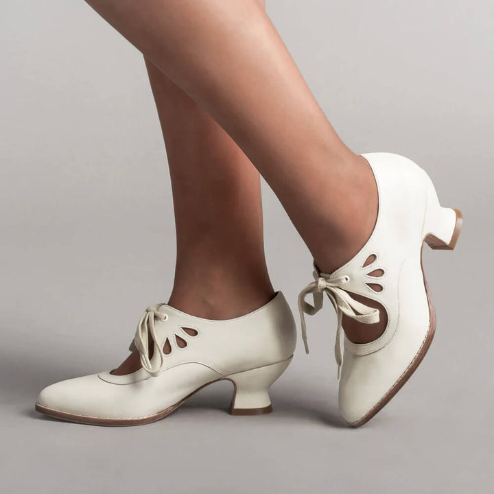 Elegant women's lace-up Mary Jane heels. Vintage pin-up style, comfortable block heel. Retro fashion footwear.