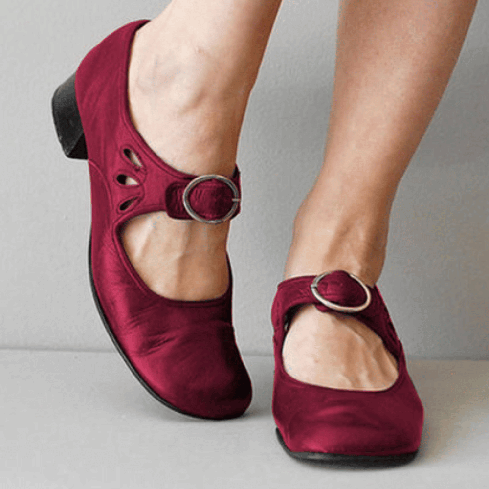 Close-up of women's medieval cosplay shoes, showing intricate buckle detail & comfortable low heel for period style.