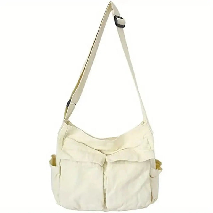 Casual women's vintage multi-pocket canvas bag, designed as a tote or crossbody for versatile use.