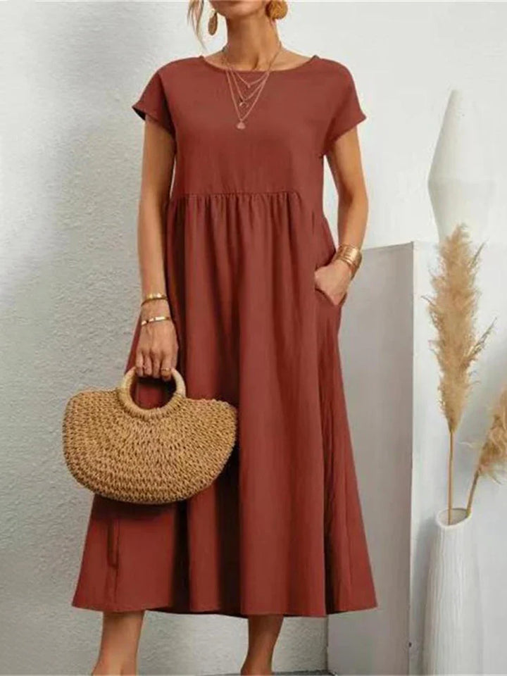 Stylish women's vintage O-neck midi dress for everyday wear; classic fall & spring fashion.