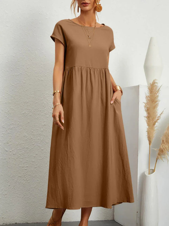 Elegant women's O-neck midi dress in a vintage style, ideal for versatile spring & summer wear.
