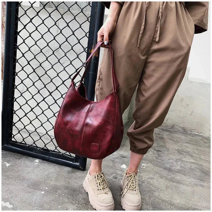 Women's vintage faux leather hobo shoulder bag. Soft, chic, and versatile everyday casual handbag.