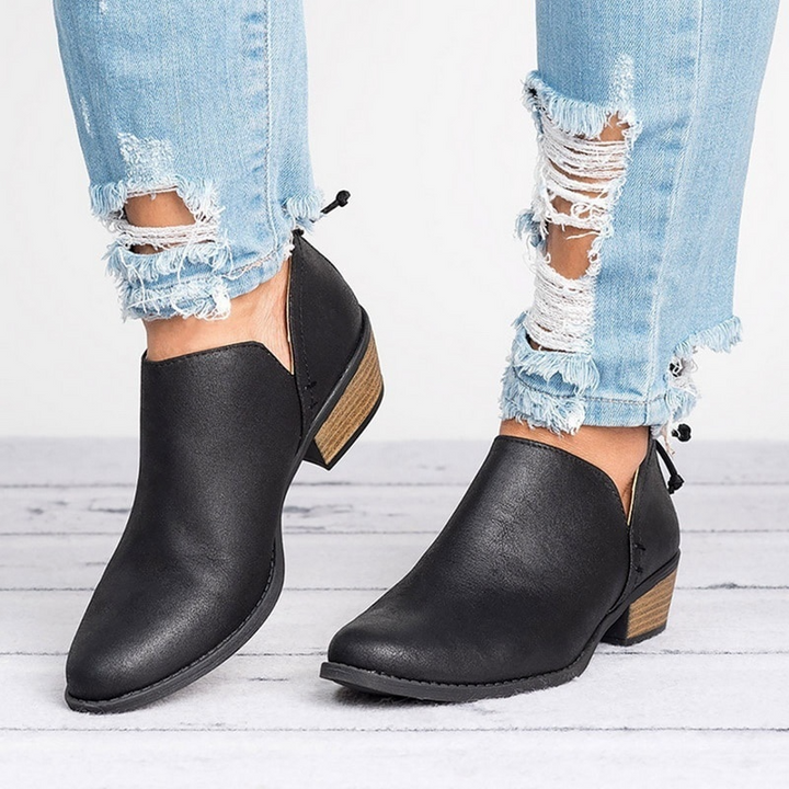 Elegant women's slip-on ankle boots with a comfortable block heel, ideal for fall and winter fashion.