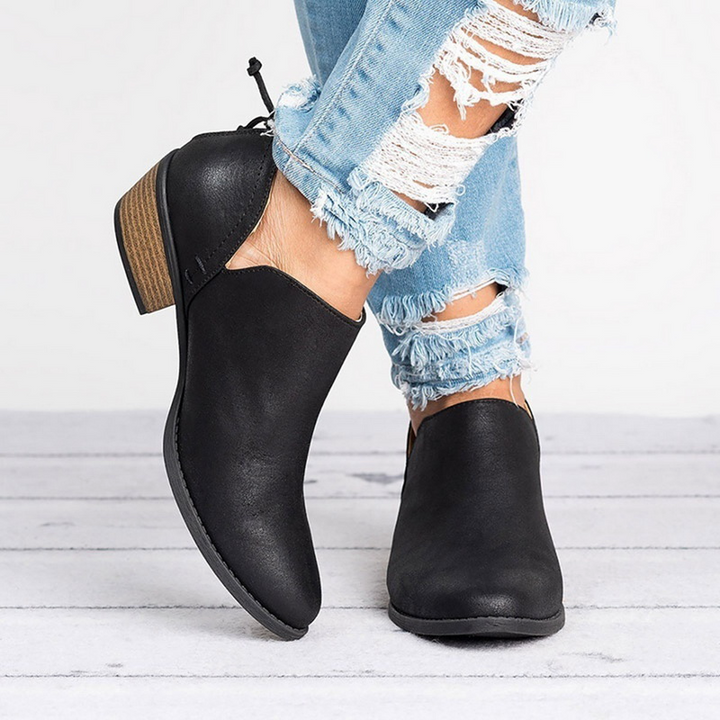 Stylish women's ankle boots, vintage style with a comfortable block heel. Versatile retro footwear for fall.
