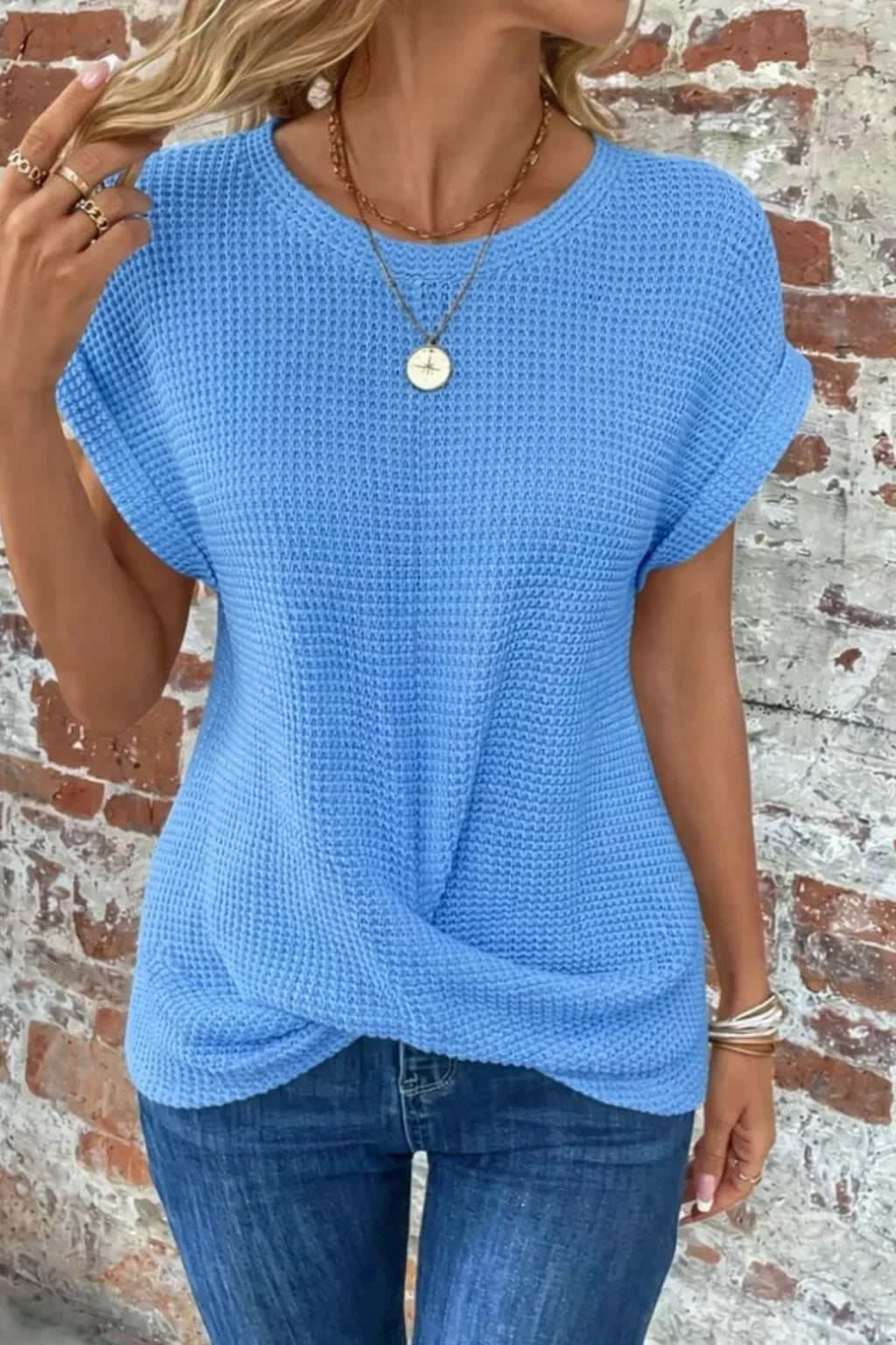 Trendy women's short sleeve waffle knit sweater with a unique front twist detail. Perfect for any occasion.